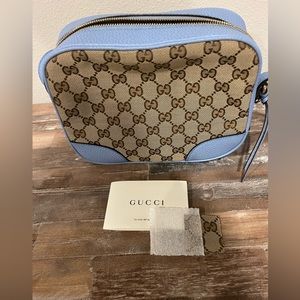 Gucci GG Canvas Camera with Blue Leather Crossbody.